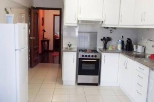 Kuchyň nebo kuchyňský kout v ubytování Apartamento Beira-Mar
