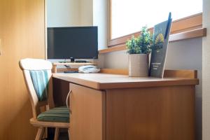 TV a/nebo společenská místnost v ubytování Hotel Sonja