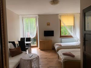 Posteľ alebo postele v izbe v ubytovaní Apartamenty pokoje "MARIA"