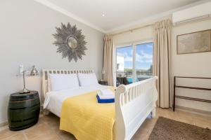 מיטה או מיטות בחדר ב-Villa Ocean Blue