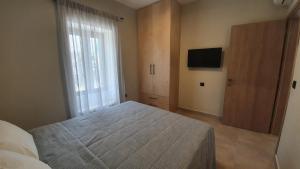 A bed or beds in a room at Villa Fouli
