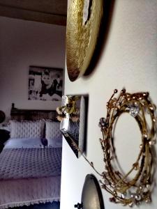 a bedroom with a bed with a mirror and a mirror at Podere Montecorno in Alberese