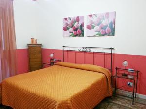En eller flere senge i et værelse på Il Cortile Fiorito