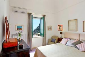 Llit o llits en una habitació de il Rifugio in Positano