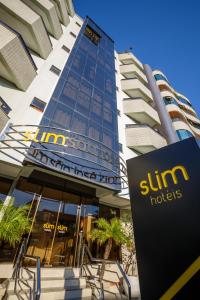 a suntrust building with a sign in front of it at Slim São José Zion in São José