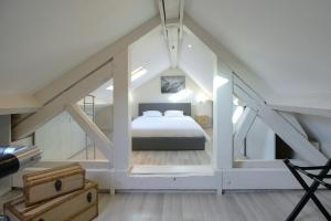 a bedroom with a bed in the attic at La Terrasse in Dijon