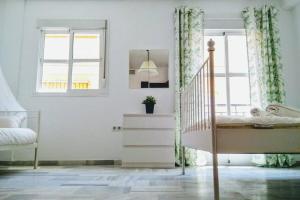 Posteľ alebo postele v izbe v ubytovaní Central Apartment in Sanlucar