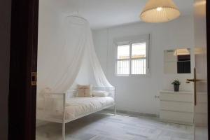 Posteľ alebo postele v izbe v ubytovaní Central Apartment in Sanlucar