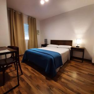 Posteľ alebo postele v izbe v ubytovaní Habitaciones La MAR