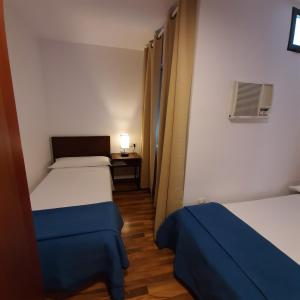 Posteľ alebo postele v izbe v ubytovaní Habitaciones La MAR