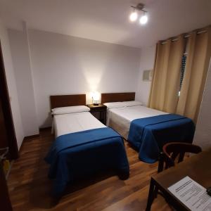 Posteľ alebo postele v izbe v ubytovaní Habitaciones La MAR