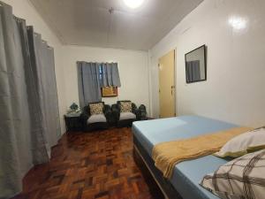 Katil atau katil-katil dalam bilik di San Fabian Vacation Home