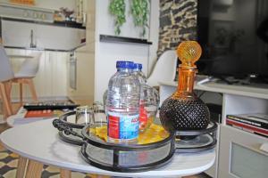 a tray with bottles and glasses on a table at Casa do Tablado - Foz Côa in Vila Nova de Foz Coa