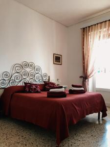 Postel nebo postele na pokoji v ubytování Casa Zi' Peppe