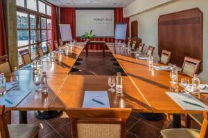 a large conference room with a large wooden table at Bakony Resort - a Felnőttbarát Hotel - Szarvaskút Vendégpark in Zirc +48 photos