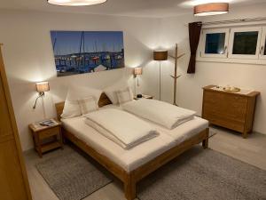 Postel nebo postele na pokoji v ubytování Haus Langweid - Moderne Ferienwohnungen mit Luxus im Inntal