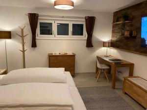 Postel nebo postele na pokoji v ubytování Haus Langweid - Moderne Ferienwohnungen mit Luxus im Inntal