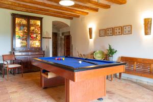a living room with a pool table in it at Mas Teixidor, Masia entre Girona y la Costa Brava in Caldes de Malavella