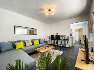 a living room with a couch and a table at Cosy Duplex in Sidi Bou Said in Sidi Bou Saïd