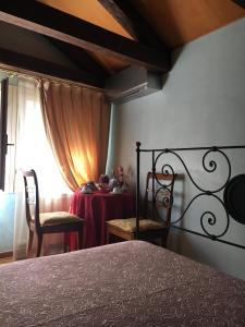 Postel nebo postele na pokoji v ubytování Suite Attico con Altana