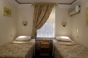 Кровать или кровати в номере Отель Шахристан