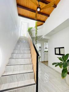 a staircase in a house with a wooden ceiling at SuitesMB in Playa del Carmen