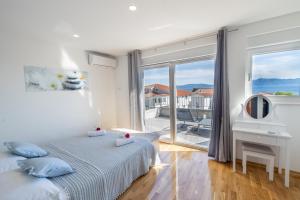Postel nebo postele na pokoji v ubytování Apartments Latkovic