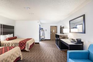 Ένα ή περισσότερα κρεβάτια σε δωμάτιο στο Americas Best Value Inn Charlotte