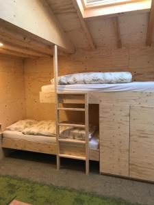 a bunk bed in a wooden cabin with two bunk beds at Guest House Amersfoort Center in Amersfoort