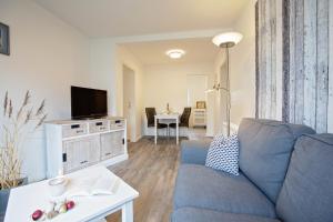 TV a/nebo společenská místnost v ubytování Appartements Hafen 31 + 22 fotografií