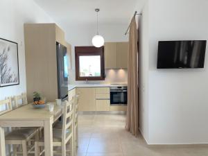 Televízia a/alebo spoločenská miestnosť v ubytovaní Blue Coast - Seaside Apartment