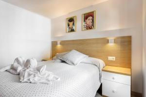 A bed or beds in a room at Casa Marosa