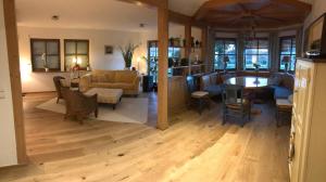 a living room with a couch and a table at Szilvias Ferienwohnung in Tittling