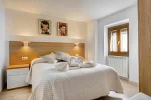 A bed or beds in a room at Casa Marosa