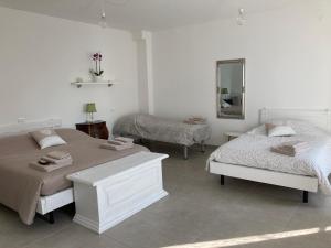 A bed or beds in a room at Casale Luel