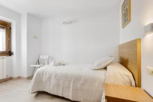 A bed or beds in a room at Casa Marosa