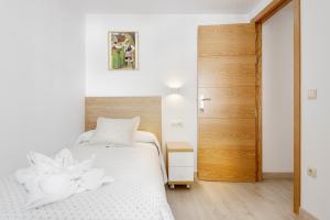 A bed or beds in a room at Casa Marosa