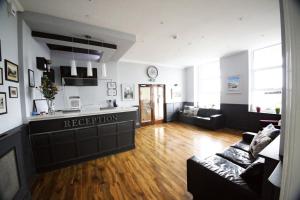 a living room with a couch and a kitchen at Crystal Cove in Hastings