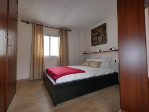 Łóżko lub łóżka w pokoju w obiekcie Petite Maison, La Laguna