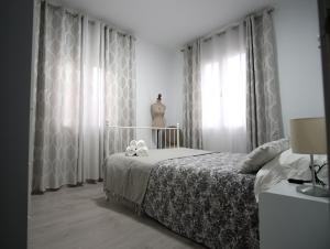 a bedroom with a bed with two teddy bears on it at Casa Vera in Roquetas