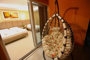 Postel nebo postele na pokoji v ubytování Karos Hotel Llaman