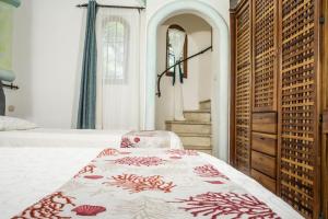Katil atau katil-katil dalam bilik di Villa Bruga en Samara Rocks