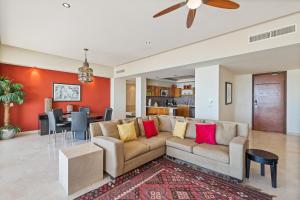 a living room with a couch and a dining room at Encanto Living Two Bedroom Unit by Kivoya in Puerto Peñasco