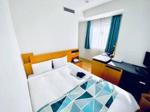 Tempat tidur dalam kamar di Hotel Flex
