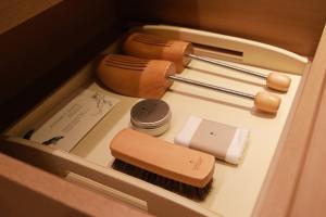 a box with a brush and other items in it at Capella Bangkok in Bangkok