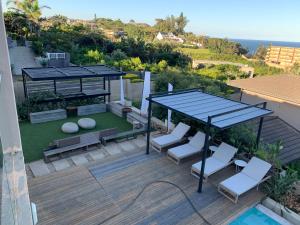an overhead view of a patio with a gazebo and chairs at Luxe Life House in Durban