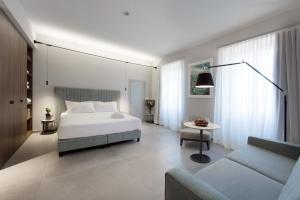 Voodi või voodid majutusasutuse Grand Hotel San Gemini I UNA Esperienze toas