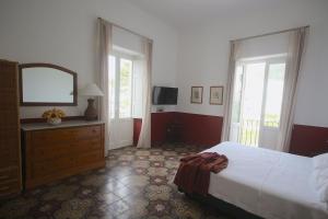 A bed or beds in a room at Villa le Pigne