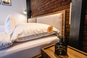 Postel nebo postele na pokoji v ubytování Garni Hotel DOCK Bratislava