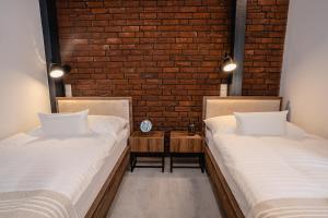 Postel nebo postele na pokoji v ubytování Garni Hotel DOCK Bratislava